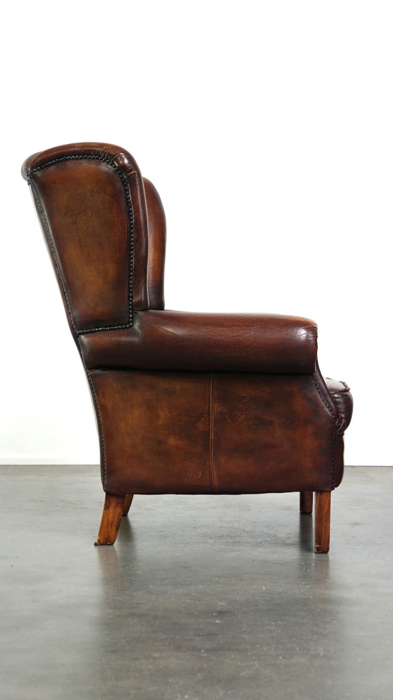 Image 1 of Schapenleren oorfauteuil met vast zitkussen