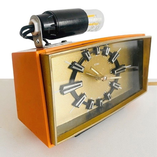 Vintage mid-century Metamec wekker oranje goud met lampje