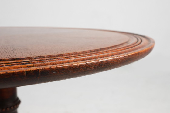 Image 1 of Antiek Engels handgesneden rond eiken bijzettafeltje met leeuwenkopvoeten