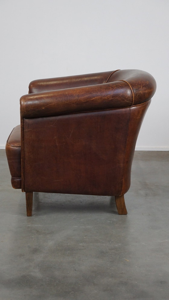 Image 1 of Vintage schapenleren clubfauteuil met een vast zitkussenintage schapenleren clubfauteuil met een vast zitkussen