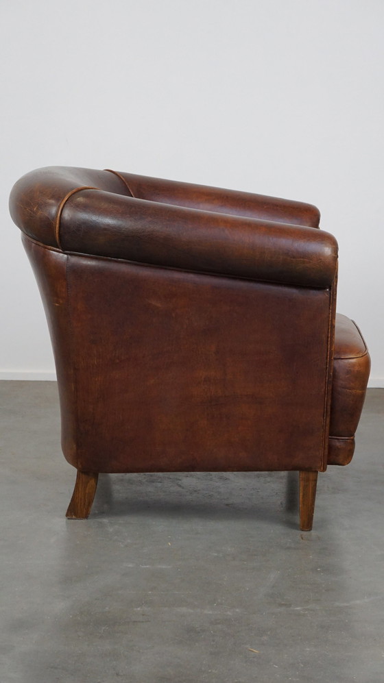 Image 1 of Vintage schapenleren clubfauteuil met een vast zitkussenintage schapenleren clubfauteuil met een vast zitkussen