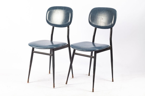 Image 1 of 2x T. Archiutti bureaustoelen in zwart metaal & donkerblauw skai