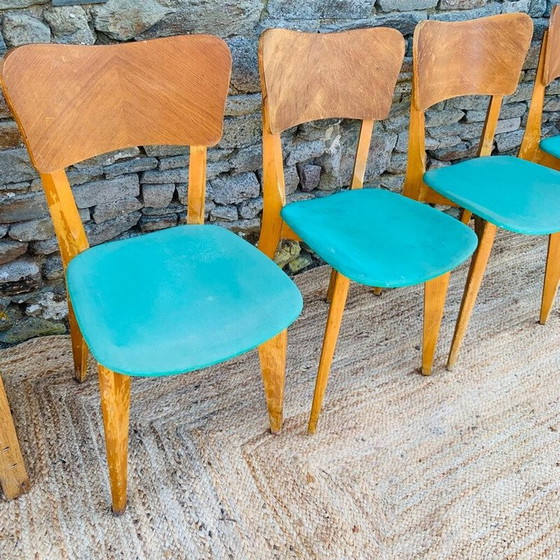 Image 1 of Set van 4 vintage vinyl houten stoelen