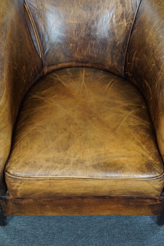 Image 1 of Schapenleren clubfauteuil met gebruikssporen