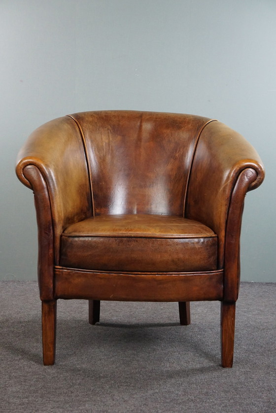 Image 1 of Schapenleren clubfauteuil, in goede staat 