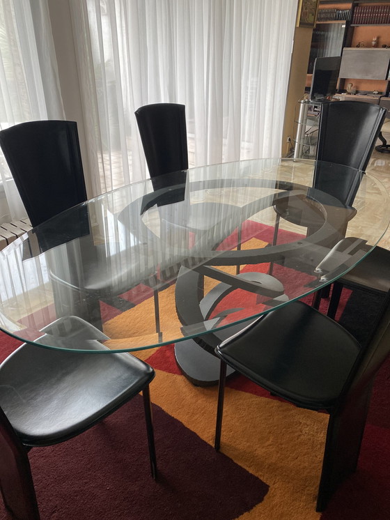 Image 1 of Glazen en gietijzeren design tafel