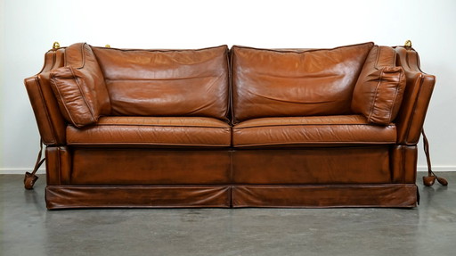 Complete set cognac kleurige rundleren kasteelbank en fauteuils