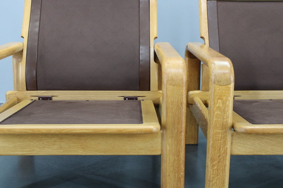 Image 1 of 1970 L. Olsen & Søn Paar fauteuils in eiken en leer, Denemarken