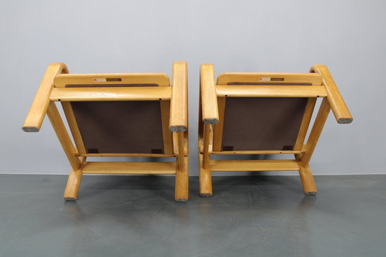 Image 1 of 1970 L. Olsen & Søn Paar fauteuils in eiken en leer, Denemarken