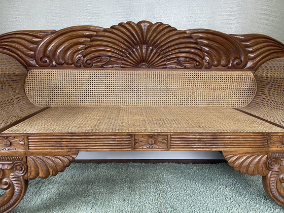 Image 1 of Javaanse teak bank met houtsnijwerk en webbing