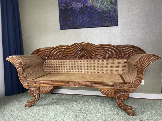 Image 1 of Javaanse teak bank met houtsnijwerk en webbing