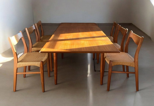 Set van 6 teakhouten stoelen Arne Wahl Iversen "Gs 60" met uitschuifbare tafel