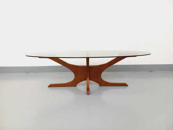 Image 1 of Hugues Poignant Vintage Ovale Salontafel in Teak en Rookglas uit de jaren 60 en 70