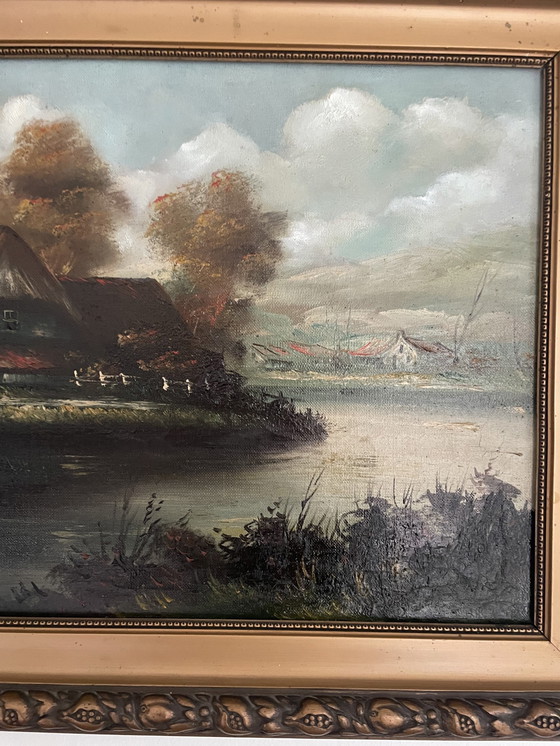 Image 1 of Schilderij Van Boerderij Aan Het Water Met Warme Kleuren En Mooie Originele Lijst