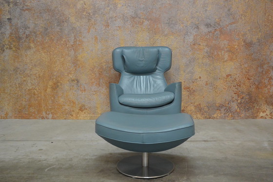 Image 1 of Leolux Ottana draaifauteuil met hocker en kussen