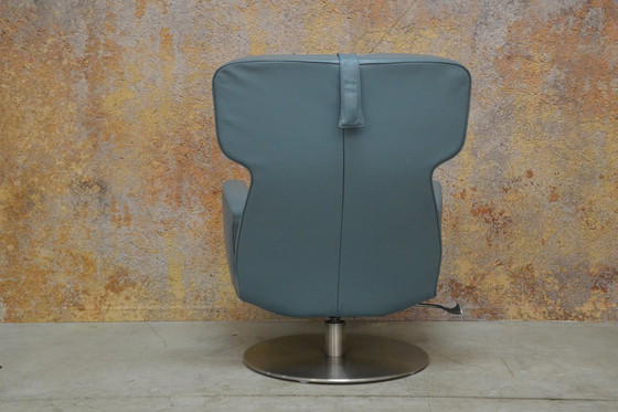 Image 1 of Leolux Ottana draaifauteuil met hocker en kussen