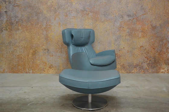 Image 1 of Leolux Ottana draaifauteuil met hocker en kussen