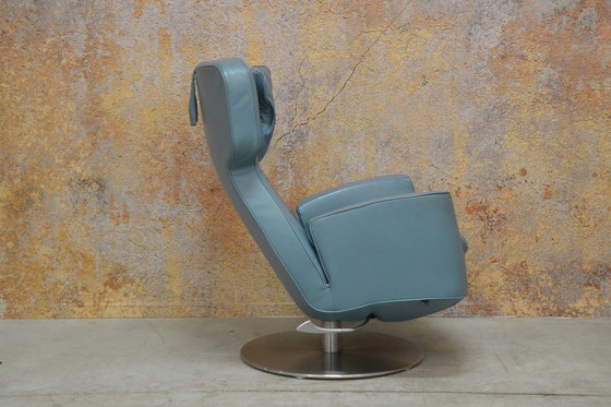 Image 1 of Leolux Ottana draaifauteuil met hocker en kussen