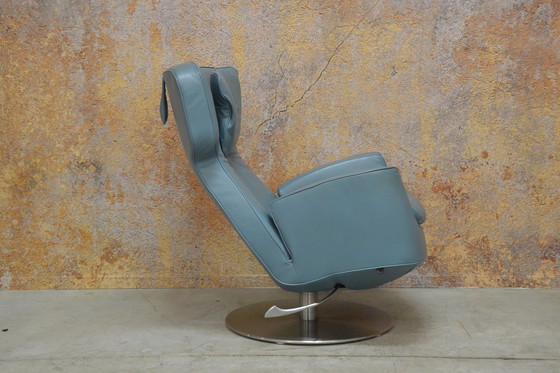 Image 1 of Leolux Ottana draaifauteuil met hocker en kussen