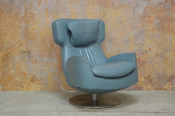 Image 1 of Leolux Ottana draaifauteuil met hocker en kussen