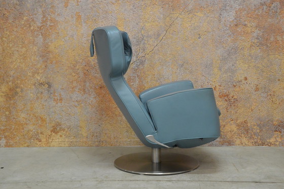 Image 1 of Leolux Ottana draaifauteuil met hocker en kussen