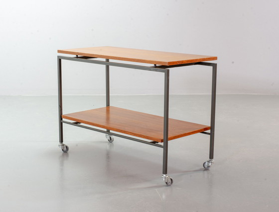 Image 1 of Minimalistische Stiemsma Mobiele Bijzettafel / Trolley met twee Teak lagen op een zwart stalen frame. Nederland