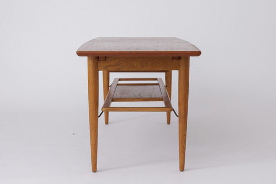 Image 1 of Deense uitschuifbare salontafel van teakhout