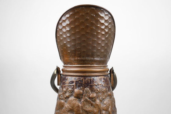 Image 1 of Koperen paraplubak met gehamerd reliëf van een middeleeuwse bakkerij, Frankrijk Ca. 1900