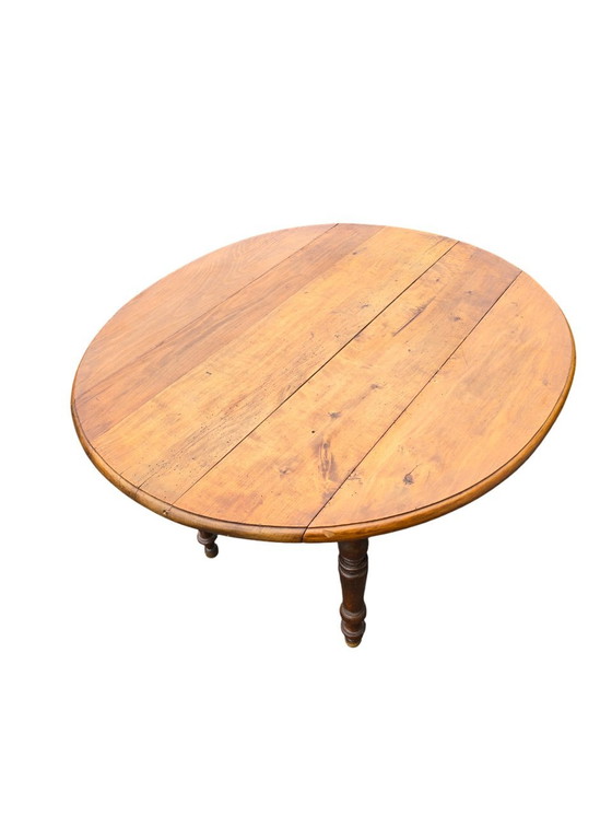 Image 1 of Ronde Antieke Houten Tafel met Inklapbare Zijkanten