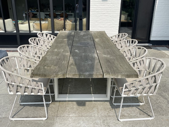 Image 1 of Meubili Tuintafel Met 8 Bijhorende Geweven Stoelen