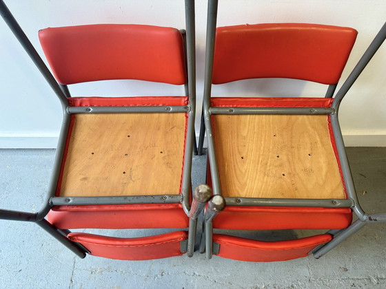 Image 1 of Set van 4 vintage stapelbare stoelen met rood vinyl