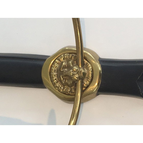 Image 1 of Paar zwart gelakte bronzen wandlampen met leeuwenkop decoraties.