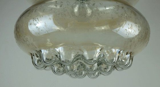 Image 1 of 1960's mid century HANGERLICHT bubbel amber glas en messing