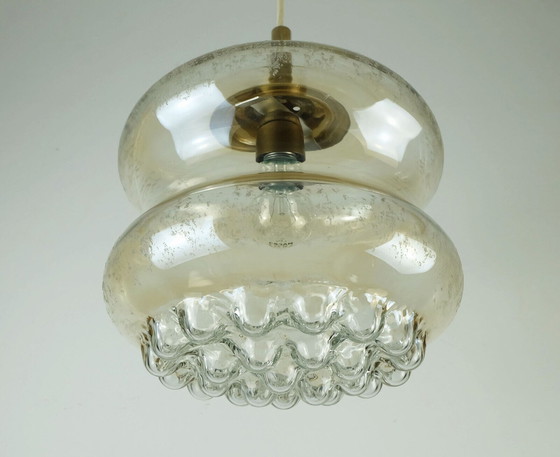 Image 1 of 1960's mid century HANGERLICHT bubbel amber glas en messing