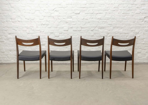 Set van vier eetkamerstoelen van teakhout en zwart kunstleer in de stijl van Webe, jaren 1960