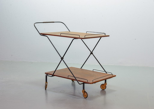 Scandinavische minimalistische opvouwbare en verrijdbare theewagen van teakhout op zwart stalen frame. Denemarken, jaren 1950