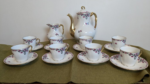 18-delig porseleinen koffieservies gesigneerd "Aux Lions de Faïence Paris".