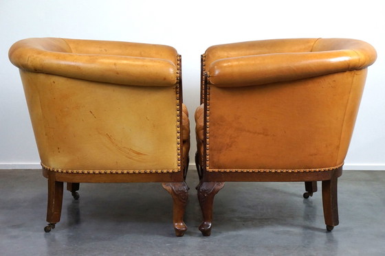 Image 1 of Set van 2 clubfauteuils en een bank, cognac kleurig leer en wieltjes