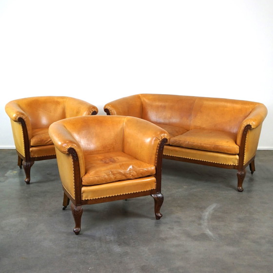 Image 1 of Set van 2 clubfauteuils en een bank, cognac kleurig leer en wieltjes