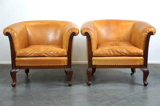 Image 1 of Set van 2 clubfauteuils en een bank, cognac kleurig leer en wieltjes