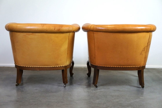 Image 1 of Set van 2 clubfauteuils en een bank, cognac kleurig leer en wieltjes