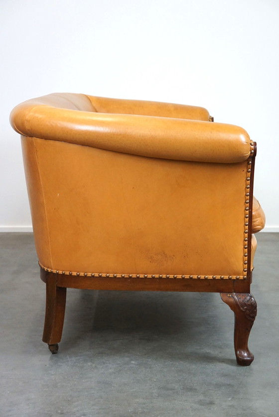 Image 1 of Set van 2 clubfauteuils en een bank, cognac kleurig leer en wieltjes