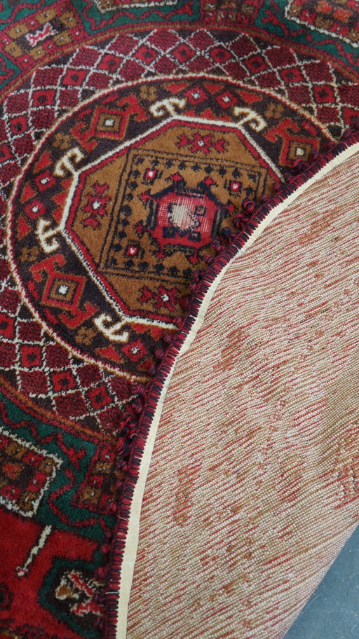 Rond vintage wollen vloerkleed met rood en geelbruine tinten 150x150cm