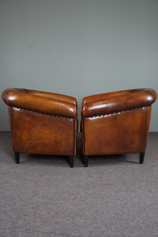 2x Vintage schapenleren clubfauteuils