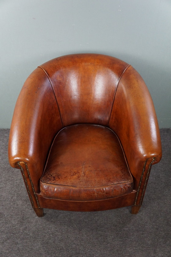 Image 1 of Schapenleren clubfauteuil in een warme cognac/ kastanje kleur