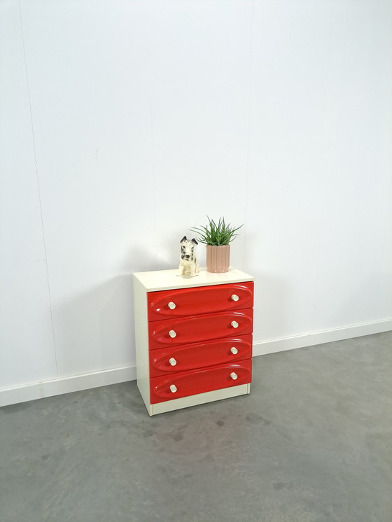 Image 1 of Vintage ladekast met rood roze kunststof lades 1970