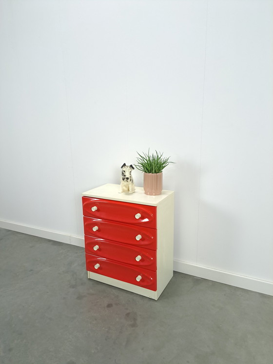 Image 1 of Vintage ladekast met rood roze kunststof lades 1970