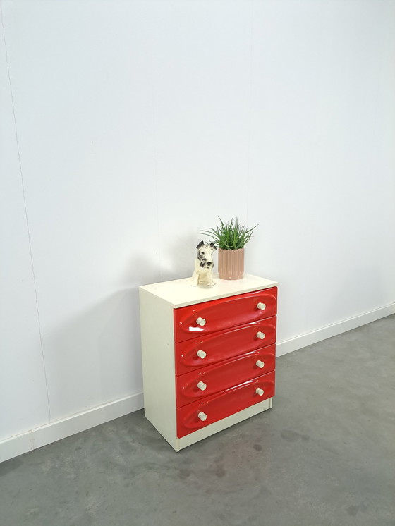 Image 1 of Vintage ladekast met rood roze kunststof lades 1970