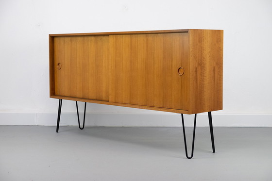 Image 1 of Vintage notenhouten Dressoirs met schuifdeuren, jaren 60