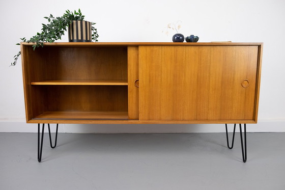 Image 1 of Vintage notenhouten Dressoirs met schuifdeuren, jaren 60